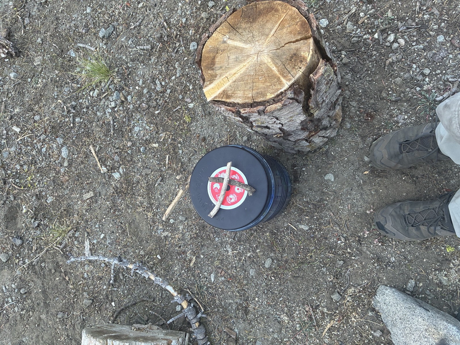 The sticks still crossed on the bear canister.